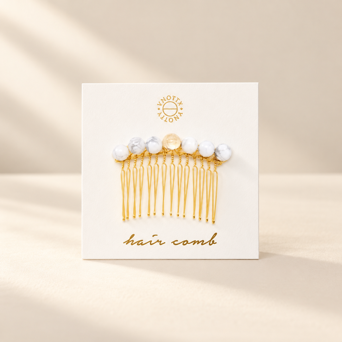 Studio presentation of Tessa Gemstone Hair Comb — White Howlite & Gold